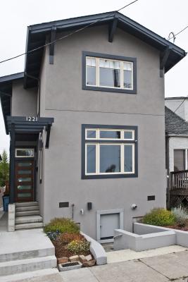 Photo of lifted Berkeley bungalow from the street after completion