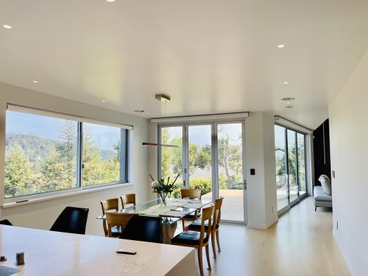 Floor to ceiling windows frame Bay Area views.