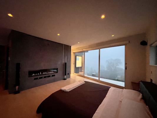 The master bedroom has sliding doors to wander outside.