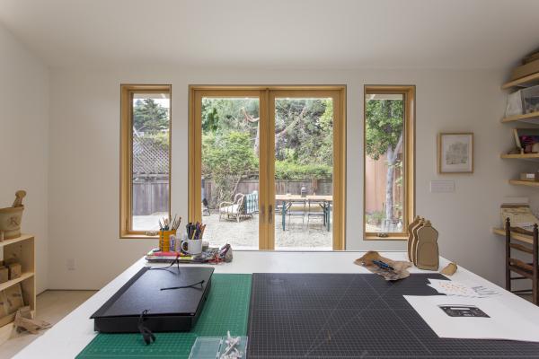 The large work space looks out into the backyard.