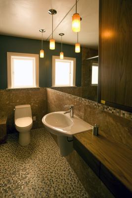 Mirror, floating sink & high medicine cabinet visually englarge the Bathroom.